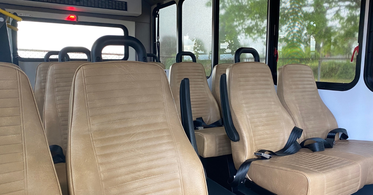interior of a senior living bus with brown seats